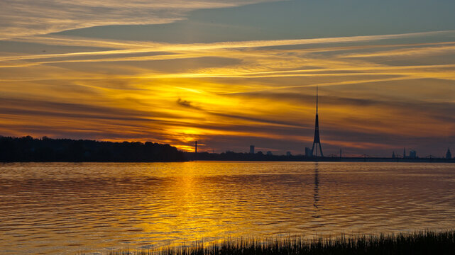 sunset on the river, in the photo the Daugava river in the evening
