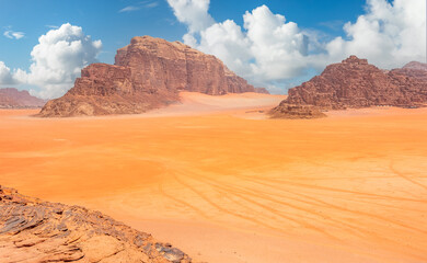 Fototapeta na wymiar Red sands, mountains and marthian landscape panorama of Wadi Rum desert, Jordan