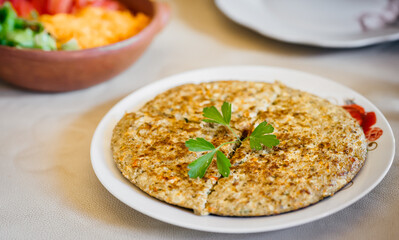 Close up of a healthy, delicious, gluten-free and veggie quinoa frittata (similar to omelette or pie). Quinoa is an ancient plant from the Andes mountains used by native people of South America.