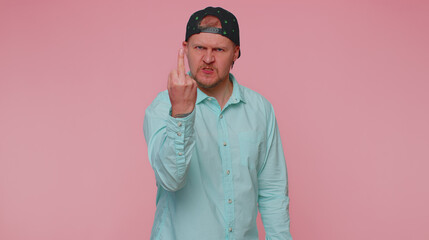 Aggressive crazy hooligan man showing around his middle finger, demonstrating protest with impolite...