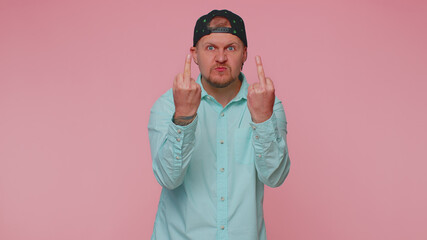 Aggressive crazy hooligan man showing around his middle fingers, demonstrating protest with...