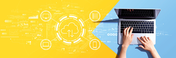 Obraz na płótnie Canvas Cloud computing with person using a laptop computer