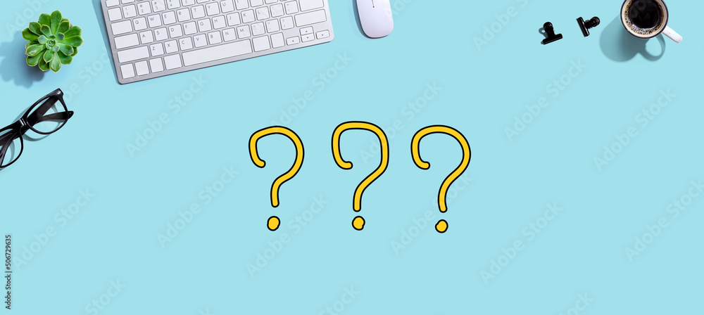 Poster question marks with a computer keyboard and a mouse