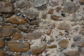 stone wall, in the photo an old stone wall made of large stones