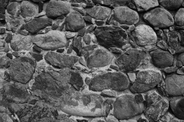 gray background, in the photo an old stone wall made of large stones