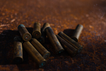 smoking spent cartridge cases from a hunting rifle, murder, danger, war