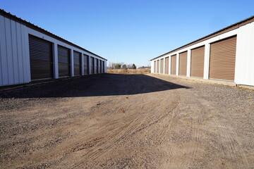 Obraz premium Storage unit buildings sit outside holding the owner's property.