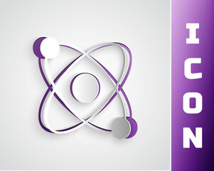 Paper cut Atom icon isolated on grey background. Symbol of science, education, nuclear physics, scientific research. Paper art style. Vector