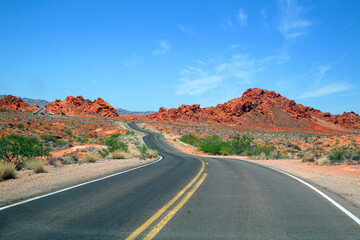 Winding road in red colorful desert mountain in southwest USA