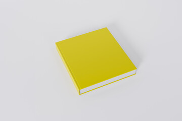 Mockup of a square book with a blank glossy yellow cover on white background. Isolated with clipping path.