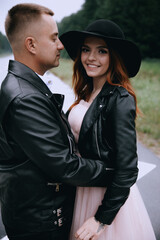 funny wedding couple outdoor.Stylish wedding couple portrait 