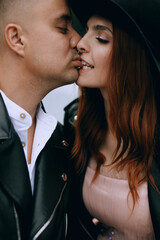 funny wedding couple outdoor.Stylish wedding couple portrait 