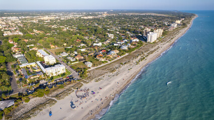Fototapeta na wymiar Venice beach Florida near Sarasota and Fort Myers. Panorama of Florida city. Flying on drone over Venice beach FL. Gulf of Mexico beach. Summer vacation. View on Residential house, Hotels and Resorts.