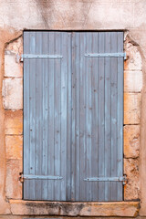 Obraz na płótnie Canvas Windows with blue wooden shutters