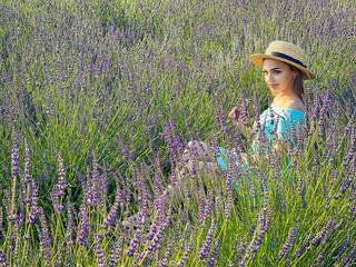 Beautiful young woman in the lavender fields.