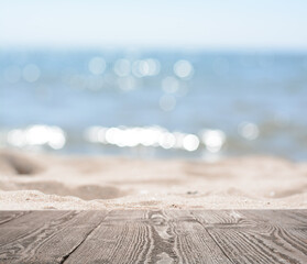 Fototapeta na wymiar Empty wooden surface on beach near sea. Summer season