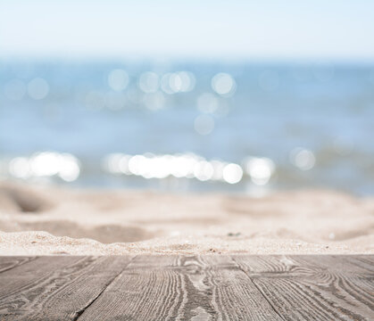 Empty wooden surface on beach near sea. Summer season