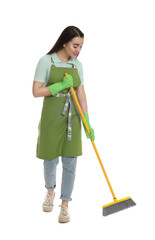 Beautiful young woman with broom on white background