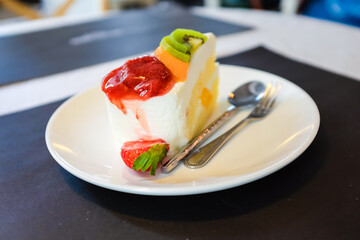 Colourful strawberry kiwi fruit cream cake