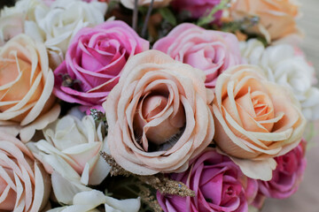 Beautiful Garden roses with a vintage vibe.  Flowers on a dark background, soft and romantic. Close-up. 