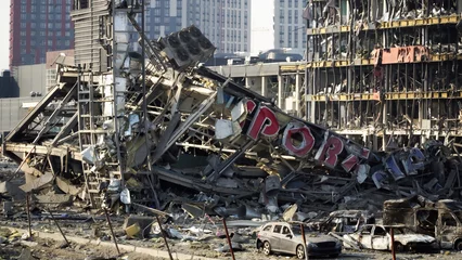 Poster Kyiv, Ukraine - 21.03.2022: War in Ukraine. Russian rocket blew up a shopping center in Kyiv © tsirika