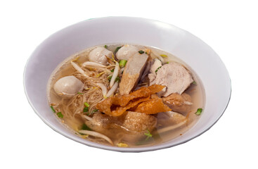 Traditional egg noodles soup with fish ball, shrimp meatball, pork, fried wonton and bean sprouts in white bowl isolated on white background with clipping path. Asian style food. Selective focus.