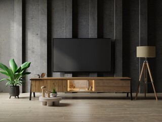 TV in modern living room with table and plant on concrete wall background.