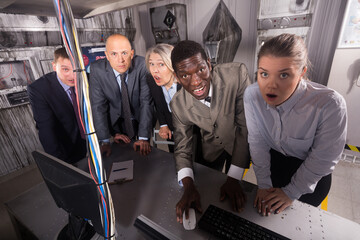 Shocked businesspeople thinking about solving conundrum in closed space of lost room-lab. Concept...