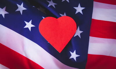 Love for America. Heart on the background of the USA flag.