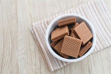 Square wafer biscuits, Crunchy wafers with chocolate cream flavor
