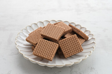 Square wafer biscuits, Crunchy wafers with chocolate cream flavor

