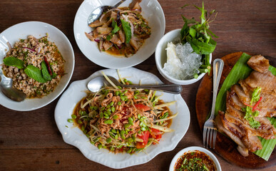 papaya salad on the table, thai spicy food
