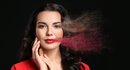 Young woman with beautiful makeup on black background