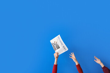 People reaching out to newspaper on blue background