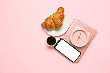 Composition with mobile phone, alarm clock, notebook and breakfast on color background