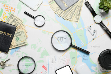 Guide's belongings with magnifiers on city map