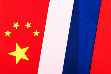 Fototapeta premium Fragments of Russian and Chinese flags