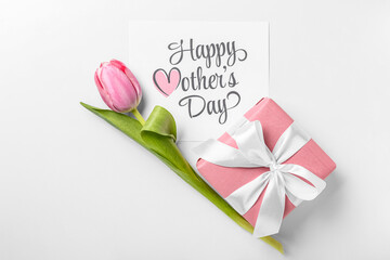 Card with text HAPPY MOTHER'S DAY, pink tulip and gift box on white background
