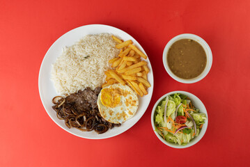 Meal - Steak with onions on horseback, rice, beans, salad and french fries