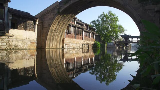aerial view of old house and old arch stone bridge over river in huzhou nanxun
