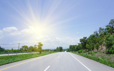 Fototapeta premium Lanscape, blue sky with white clouds with golden sunlight shining on the path of journey into the world.