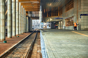 October 23, 2019 Minsk Belarus Railway station close-up.The maintenance staff is walking along the...