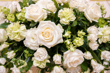 Takasago flowers with lots of pure white roses