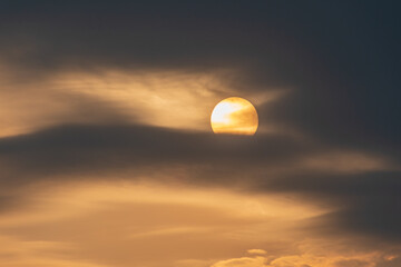 sunset with reflections and cloudy sky