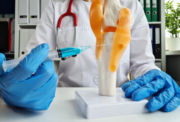 Injection for osteoarthritis of knee closeup. Osteoporosis of bones - obrazy, fototapety, plakaty