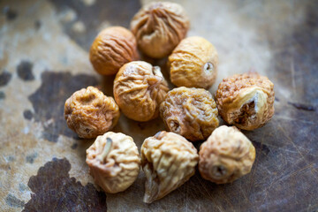 Obraz premium Pile of traditional Chinese medicine ingredients, dried figs close-up