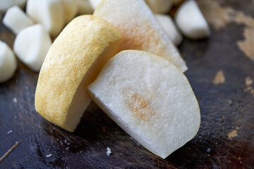 Close-up of a fresh pear cut on a cutting board