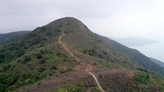 Flying through the mountains in the Ling Wui Shan, Hike and countryside in Lantau Island, Hong Kong