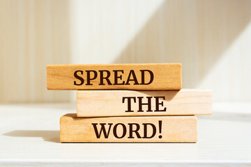Wooden blocks with words 'Spread The Word'.