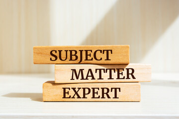 Wooden blocks with words 'SUBJECT, MATTER, EXPERT'. Business concept.